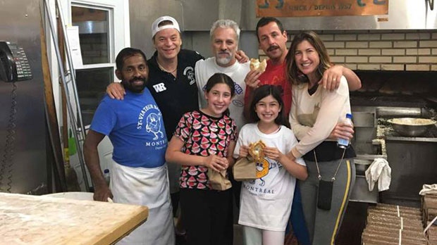 Adam Sandler and the bagel shop staff 
