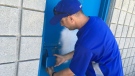 Windsor South Little League president Jim Downes checks the lock at the clubhouse, which has been broken into twice this week. (Bob Bellacicco / CTV Windsor)
