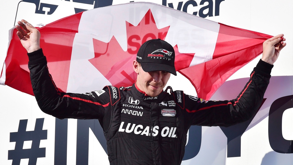 Robert Wickens celebrates his third place finish a