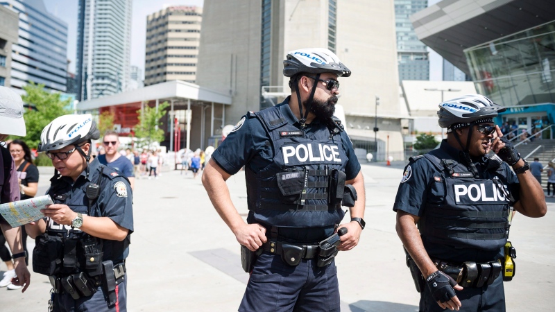 Police are seen in Toronto, on Thursday, July 12, 2018. (THE CANADIAN PRESS/Christopher Katsarov)
