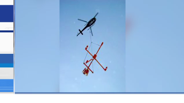 Helicopter conducting aerial resource survey