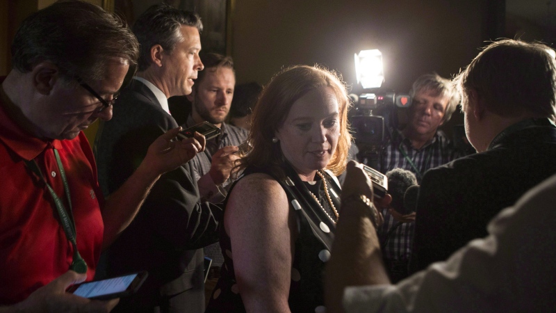 Ontario Minister of Children, Community and Social Services Lisa Macleod turns away after scrumming with reporters at the Ontario Legislature, in Toronto on Thursday, July 5, 2018. THE CANADIAN PRESS/Chris Young