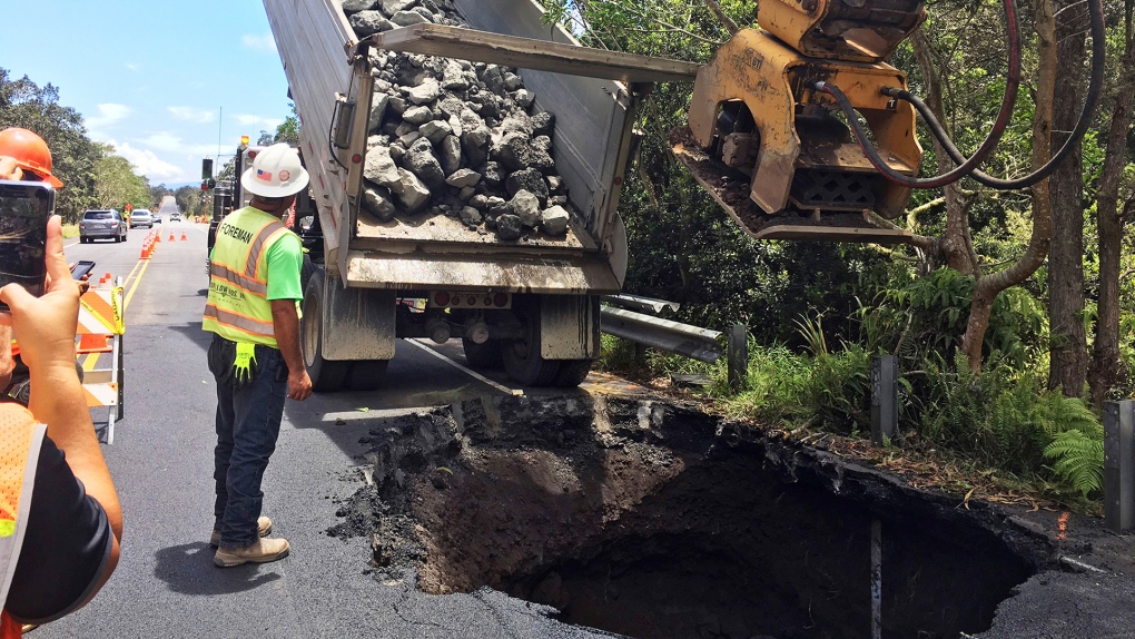 Workers repair a sinkhole in Hawaii
