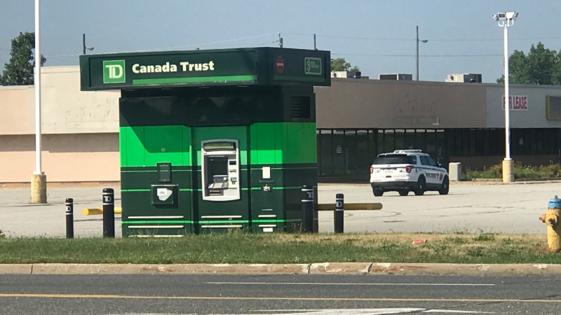 Police are investigating after an armed robbery at an ATM on Dougall Avenue in Windsor, Ont., on Friday, Aug. 3, 2018. (Alana Hadadean / CTV Windsor) 
