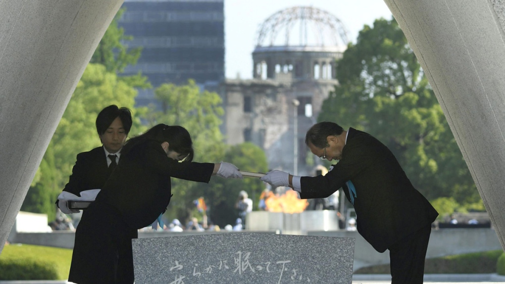 Dedicating the list of victims of atomic bombing