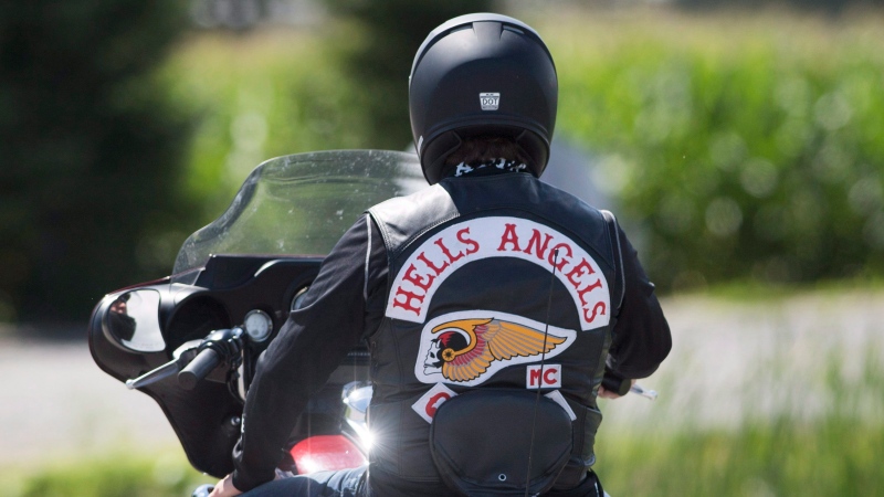 A member of the Hells Angels arrives for a national gathering in Saint-Charles-sur-Richelieu, Que., Friday, August 10, 2018.THE CANADIAN PRESS/Graham Hughes