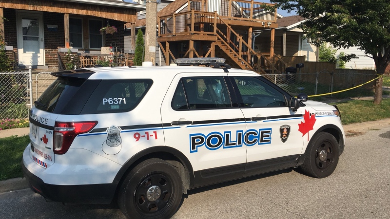 Windsor Police are sitting outside a taped up home in the 1200 block of Henry Ford Centre Drive for a shooting investigation in Windsor, Ont., on Tuesday, Aug. 14, 2018. (Chris Campbell / CTV Windsor)
