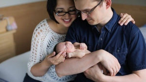 Calgary Shepard MP Tom Kmiec and his wife Evangeline hold their daughter Lucy-Rose. (Tom Kmiec / Facebook)
