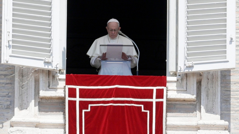 In this Sunday, Aug. 19, 2018 file photo, Pope Francis prays for the victims of the Kerala floods during the Angelus noon prayer in St.Peter's Square, at the Vatican. (AP Photo/Gregorio Borgia, File)