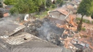 The aftermath of the explosion at Sprucedale Crescent. The house was completely destroyed, and the adjacent homes also caught fire. (WRPS / Twitter)