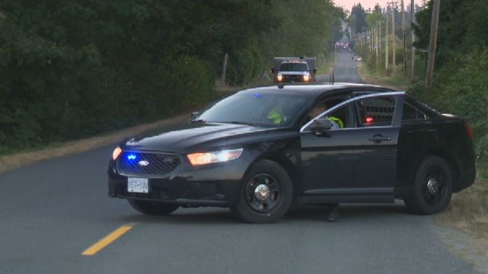An unmarked Central Saanich Police vehicle cordons off Central Saanich Road after a fatal collision. Mon., Aug. 27, 2018. (CTV Vancouver Island)