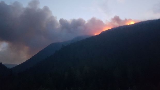 Photos posted online by the BC Wildfire Service show the 2018 wildfire season from the front lines. 
<br>The B.C. government says although wildfires have broken last year's record for the area of land burned, the human impacts have been much lower.
<br><br>A photo posted to Twitter by the BC Wildfire Service shows flames and smoke north of Blue River on Aug. 20, 2018. 