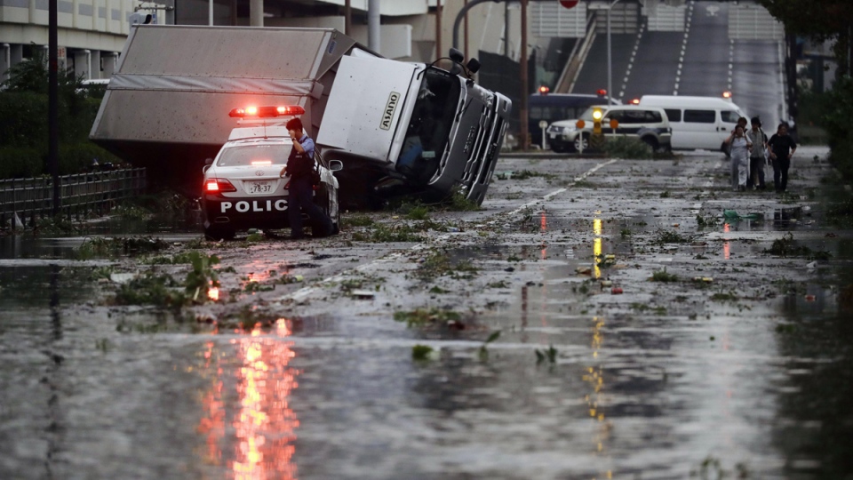 Powerful typhoon slams into western Japan, flooding airport | CTV News
