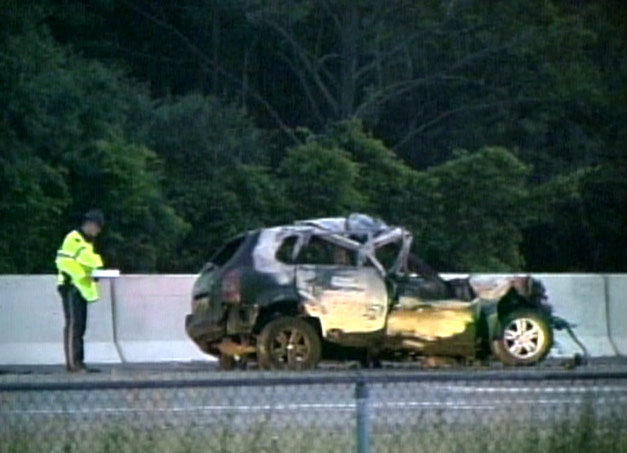 An SUV involved in the accidents sits on the side of highway 401 early Tuesday, July 10, 2007.