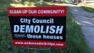 The Detroit International Bridge Company has placed lawn signs around homes in west Windsor to pressure the city to knock them down ( Teresinha Medeiros / AM800 News )