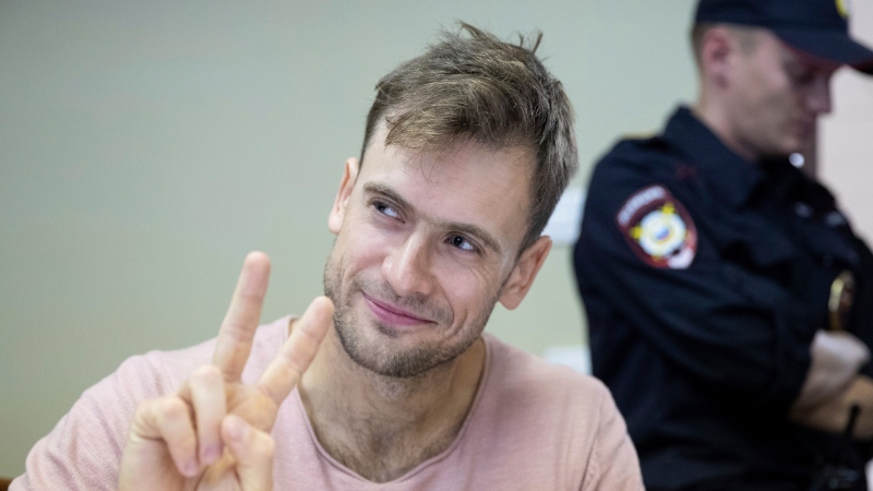 In this file photo taken on Monday, July 23, 2018, Pyotr Verzilov, a member of the feminist protest group Pussy Riot, gestures during hearings in a court in Moscow, Russia. (AP Photo/Pavel Golovkin, File)