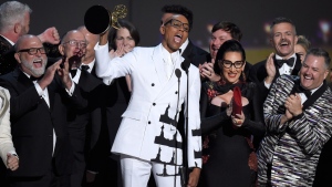 RuPaul Charles, center, and the team from "RuPaul's Drag Race" accept the award for outstanding reality/competition program at the 70th Primetime Emmy Awards on Monday, Sept. 17, 2018, at the Microsoft Theater in Los Angeles. (Photo by Chris Pizzello/Invision/AP)
