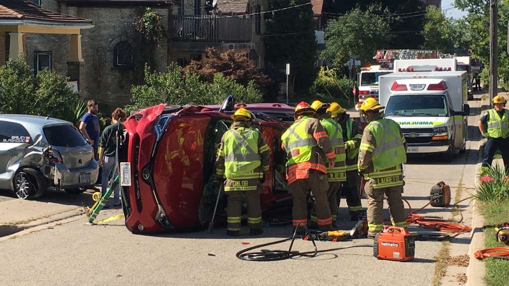 Woman extracted from flipped vehicle