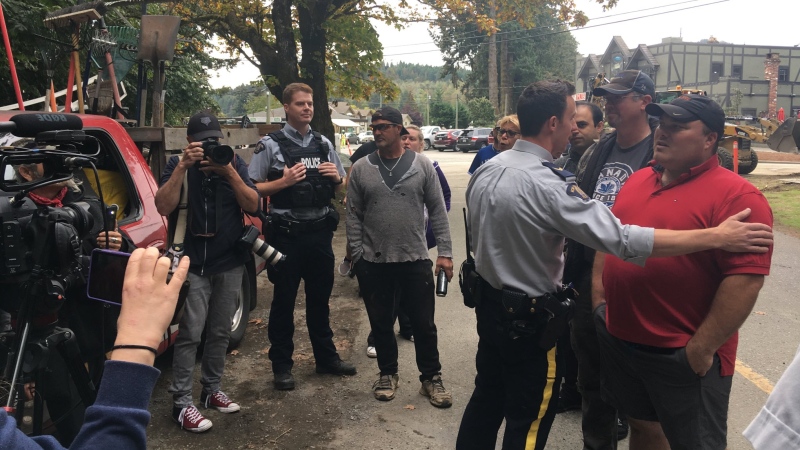 Supporters of tent city occupants clashed with neighbours of Goldstream Park after Mounties moved to shut down the latest encampment. Sept. 20, 2018. (CTV Vancouver Island)