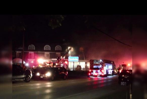 Firefighters battle at blaze at the Travelodge in Wasaga Beach on Friday, Sept. 21, 2018.
