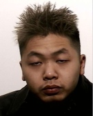 A Canada-wide arrest warrant has been issued for Steven Duong, 25, after police discovered a cache of guns, explosives and drugs in an east-end Toronto storage unit.