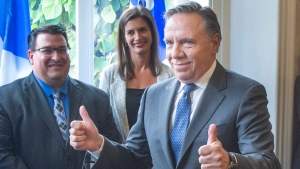 Quebec Premier-designate Francois Legault gives the thumbs up to some of his elected candidates after speaking to the media the day after after winning the provincial election Tuesday, October 2, 2018 in Quebec City.THE CANADIAN PRESS/Ryan Remiorz