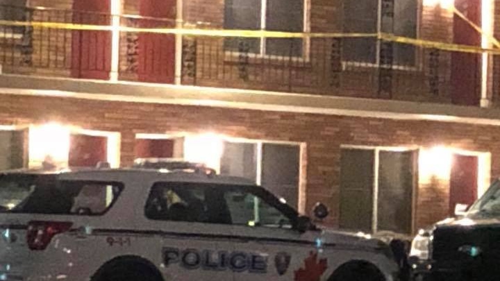 Police investigate outside a Howard Avenue hotel. (Courtesy Tony Cacihas / Facebook)