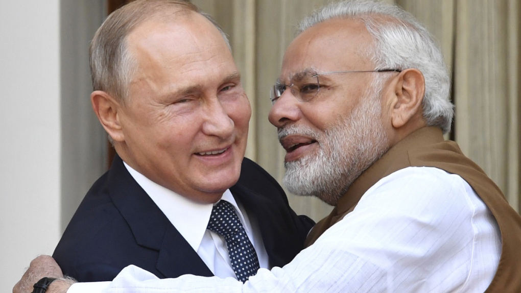 Narendra Modi and Vladimir Putin embrace