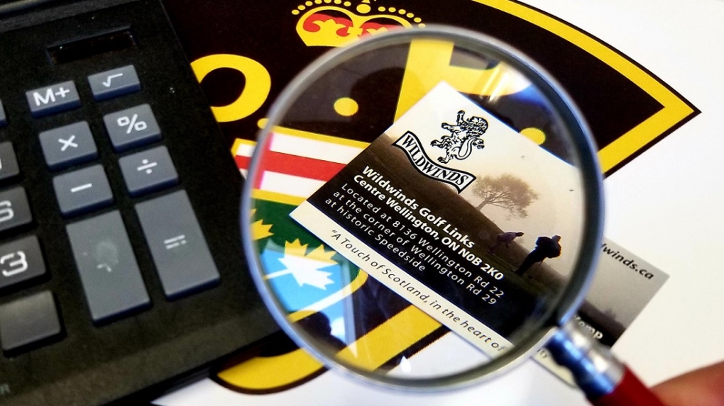A business card under a magnifying glass