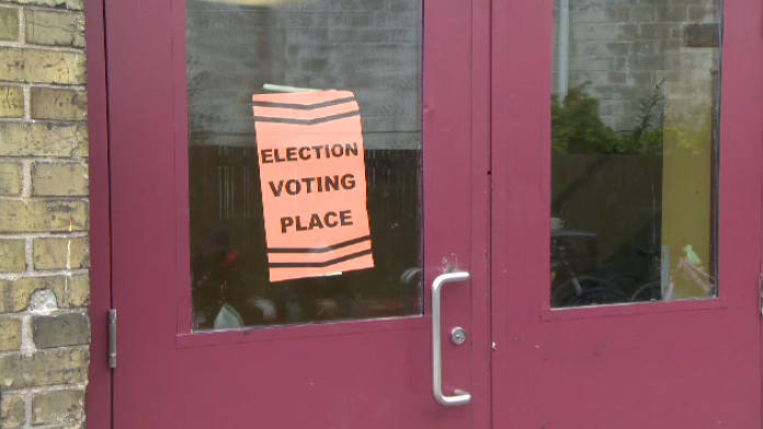 An election sign on a door