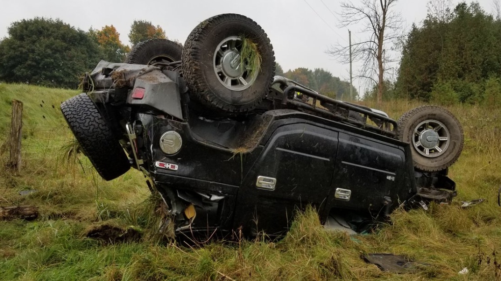 A vehicle on its roof after rolling over