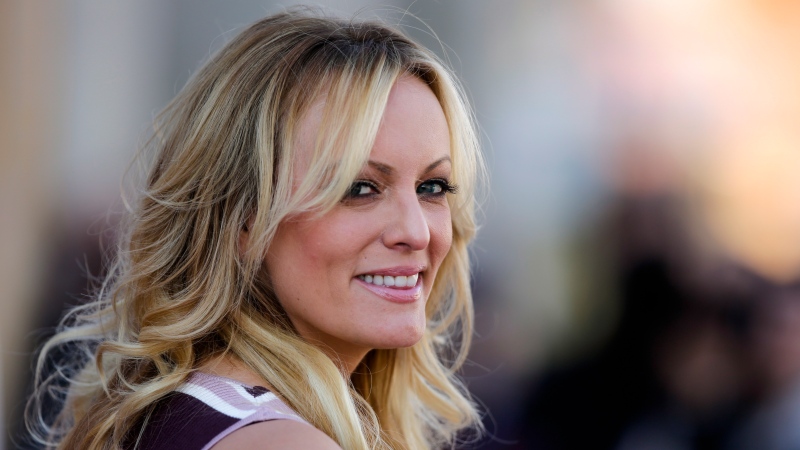 Adult film actress Stormy Daniels attends the opening of the adult entertainment fair 'Venus' in Berlin, Germany, Thursday, Oct. 11, 2018. (AP Photo/Markus Schreiber)