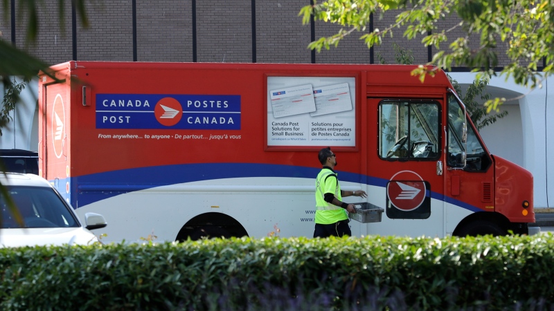 Canada Post will no longer require signatures for most packages during the COVID-19 pandemic. (AP Photo/Ted S. Warren)