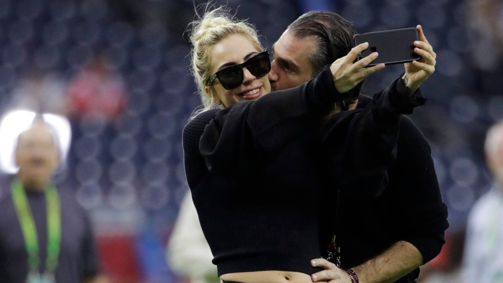 Lady Gaga takes a selfie with Christian Carino