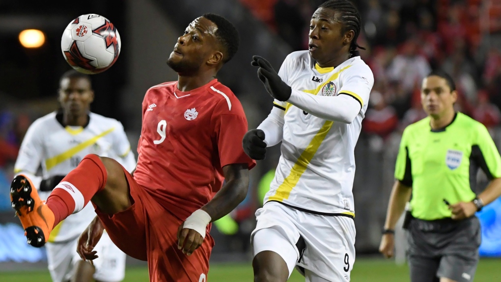 Cyle Larin, left, and Dominica's Javid George
