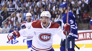 Montreal Canadiens left wing Max Domi celebrates a goal by teammate Artturi Lehkonen against the Toronto Maple Leafs during first period NHL hockey action in Toronto on Wednesday, October 3, 2018. THE CANADIAN PRESS/Nathan Denette