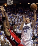 Orlando Magic forward Hedo Turkoglu (15), of Turkey, makes a shot in front of Toronto Raptors forward Chris Bosh during the second half of Game 2 in an NBA Eastern Conference playoff basketball series in Orlando, Fla., Tuesday, April 22, 2008. (AP / John Raoux)