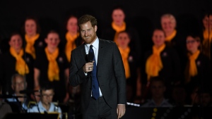 Prince Harry delivers a speech during the opening ceremony of the Invictus Games in Sydney on Saturday. (SAEED KHAN / AFP)