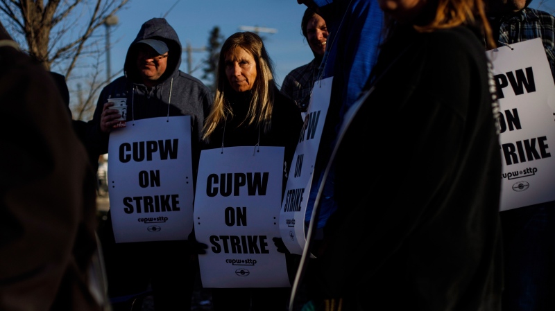 Canada Post workers picket after going on strike in Edmonton, Alta., on Monday, October 22, 2018. THE CANADIAN PRESS/Jason Franson