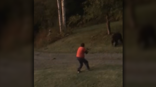 Caught on cam: Grizzly charges man in front yard