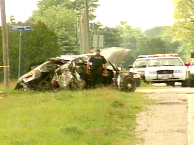 The remains of an OPP cruiser following a collision with an asphalt truck in Elgin County on Monday, July 6, 2006.