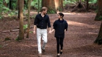 Prince Harry and Meghan, Duchess of Sussex walk through a Redwoods forest in Rotorua, New Zealand, Wednesday, Oct. 31, 2018. (AP Photo/Kirsty Wigglesworth,Pool)