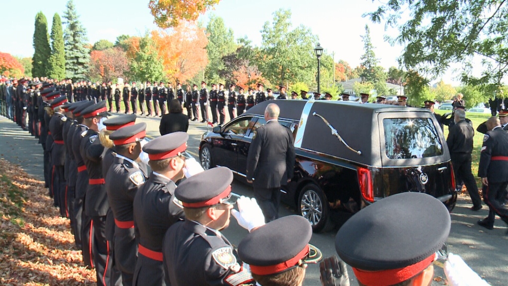 Ottawa officers attend funeral of colleague.