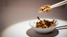 A bowl of Natto, a traditional Japanese food made from soybeans fermented with Bacillus subtilis var, sits on display at the Disgusting Food Museum, in Malmo, Sweden, on Sept. 22, 2018 (Anja Barte Telin via AP)