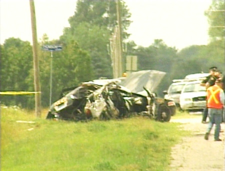 The remains of an OPP cruiser following a collision with an asphalt truck are seen near Rodney, Ont. on Monday, July 6, 2009.