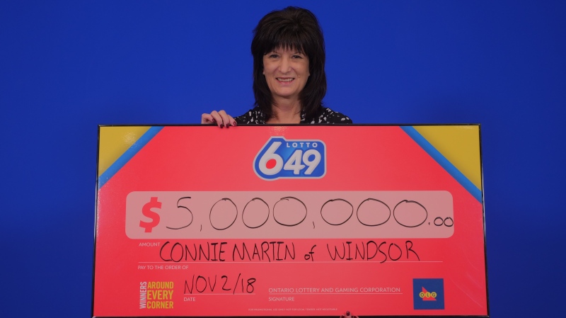 Connie Martin displays her winnings. (Courtesy OLG)