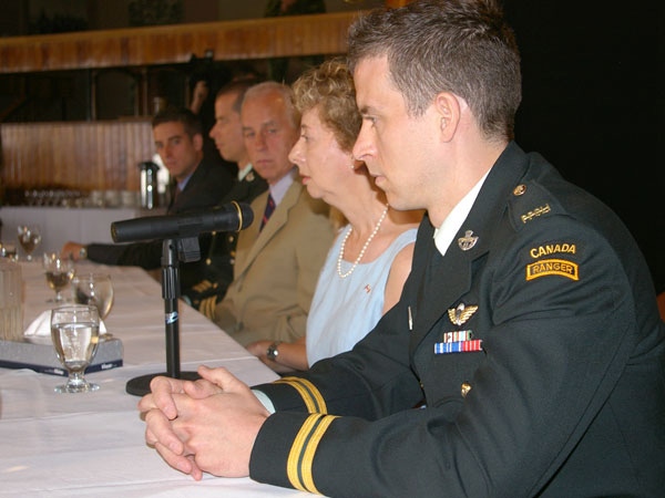 Phil Dawe, right, looks towards his family at CFB Kingston on Wednesday, July 11, 2007.
