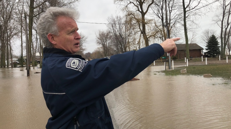 Director of Watershed Management Services Tim Byrne points out flooding in the Cotterie Park Road area in Leamington, Ont., on April 16, 2018. (Melanie Borrelli / CTV Windsor)