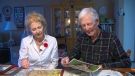 Albert Wallace, 98, and his daughter Barbara Trendos look through images and letters from the Second World War.
