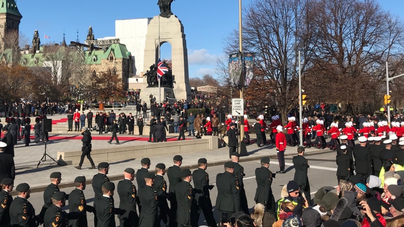 Hundreds of people gather at the National War Memorial in Ottawa for a Remembrance Day service on Sunday, Nov. 11, 2018. (Lisa LaFlamme/ CTV News)
